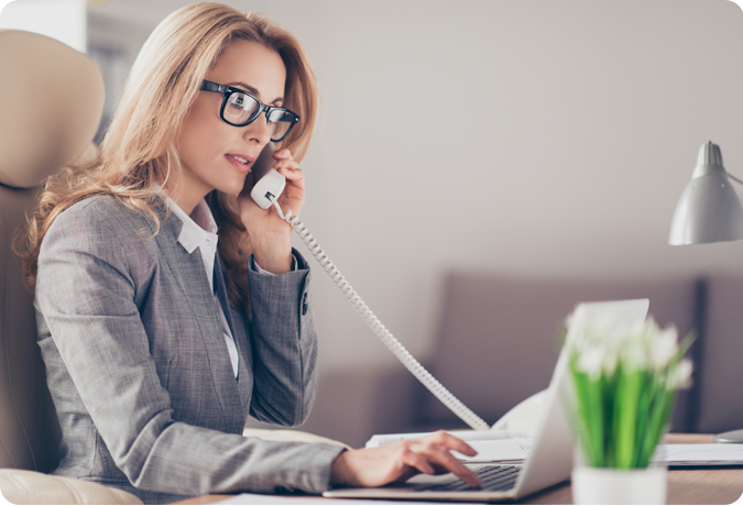 woman in suit on telephone